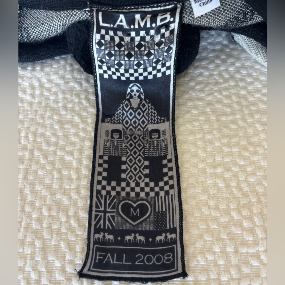 Fall 2008 L.A.M.B. Black and White Wool Poncho with Pom Pom tie.